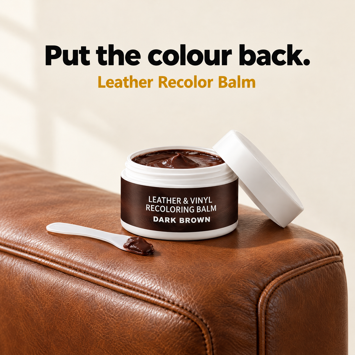 Leather Recolor Balm on a brown sofa arm
